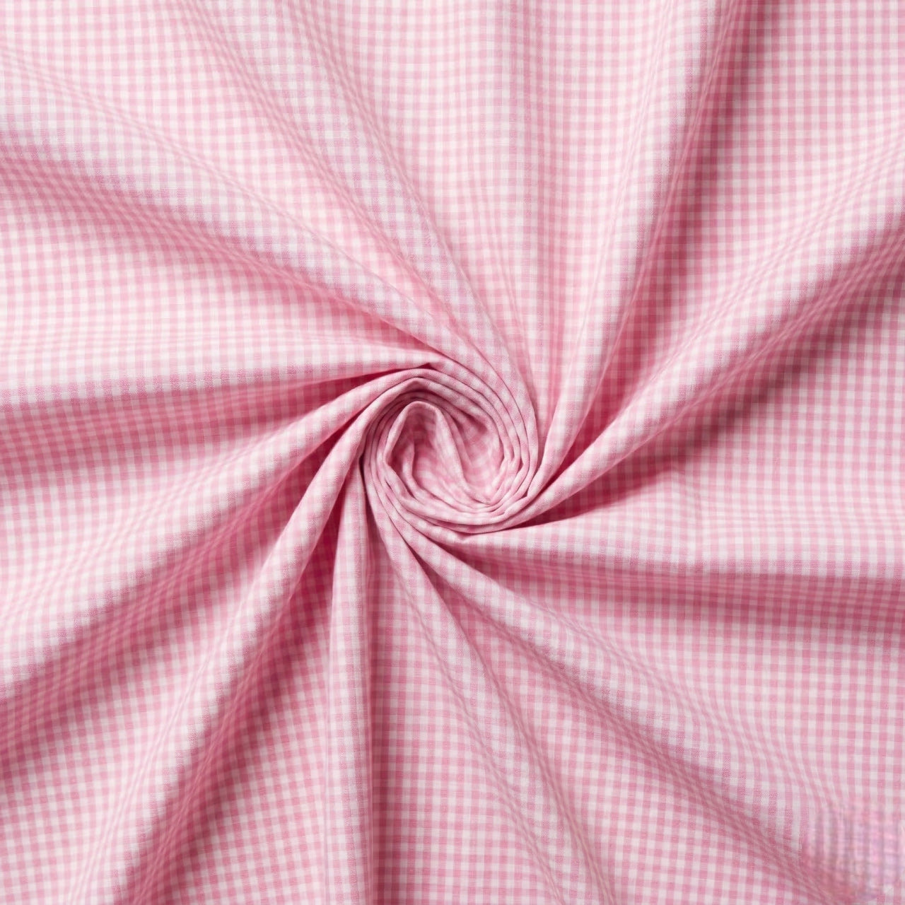 Pink gingham fabric in a swirl pattern