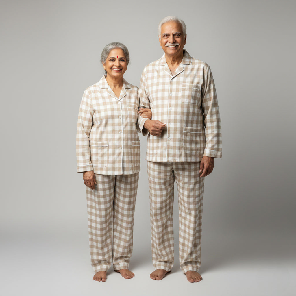 Elderly couple in beige gingham matching pajamas, classic coordinated design.