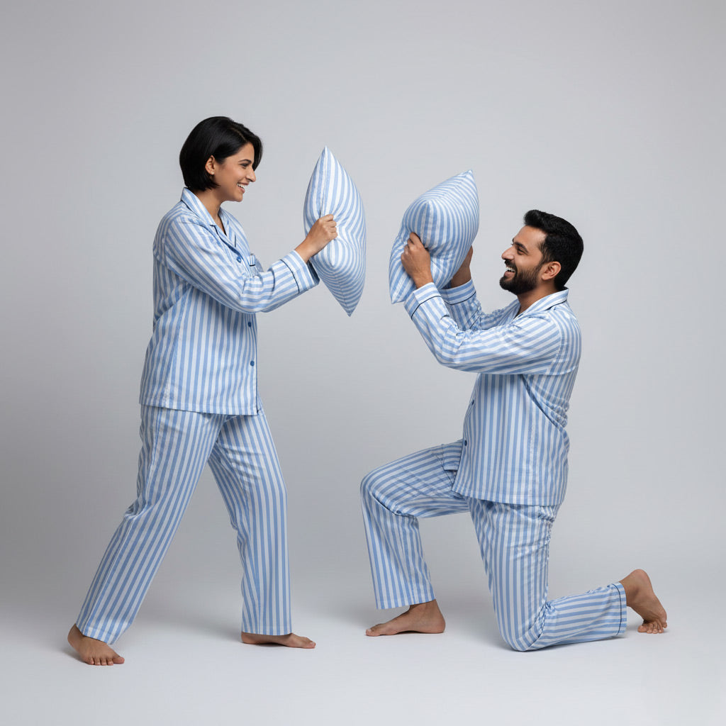 Couple wearing blue lines matching pajamas, minimal coordinated nightwear.