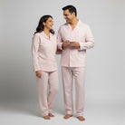Matching couple cotton pajamas in blush pink stripe with comfort fit.