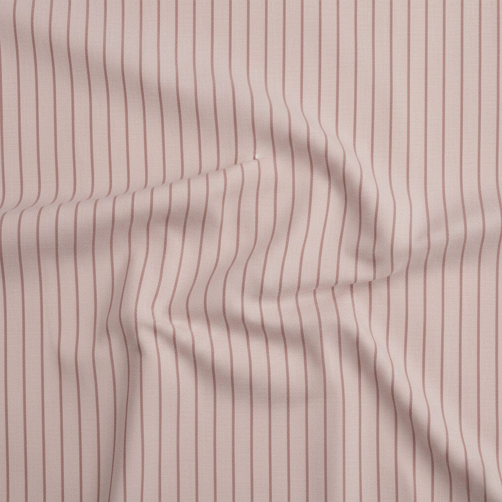Blush pink cotton fabric with soft rose stripe detailing.