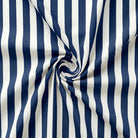 Navy and white striped fabric with a swirl pattern