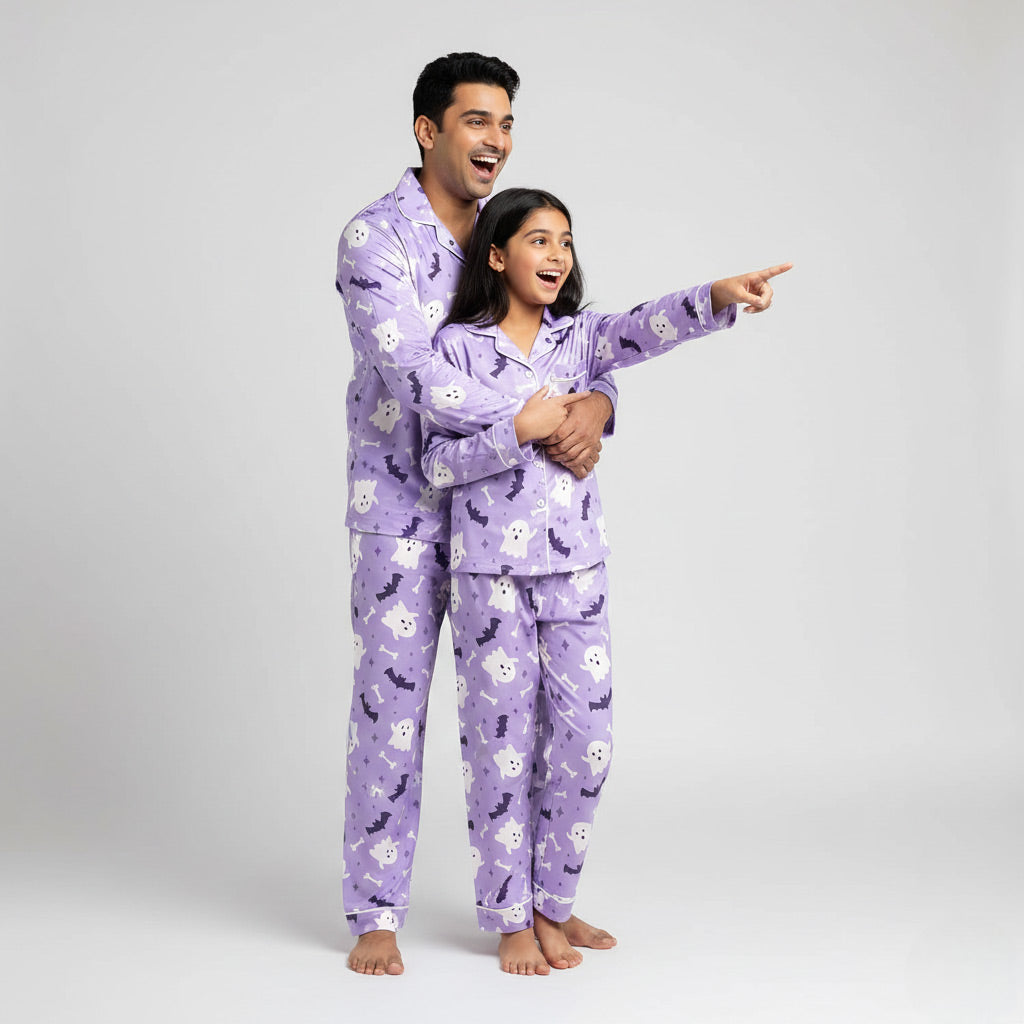 Father and daughter in Boo Crew matching pajama set, playful purple ghost print nightwear.