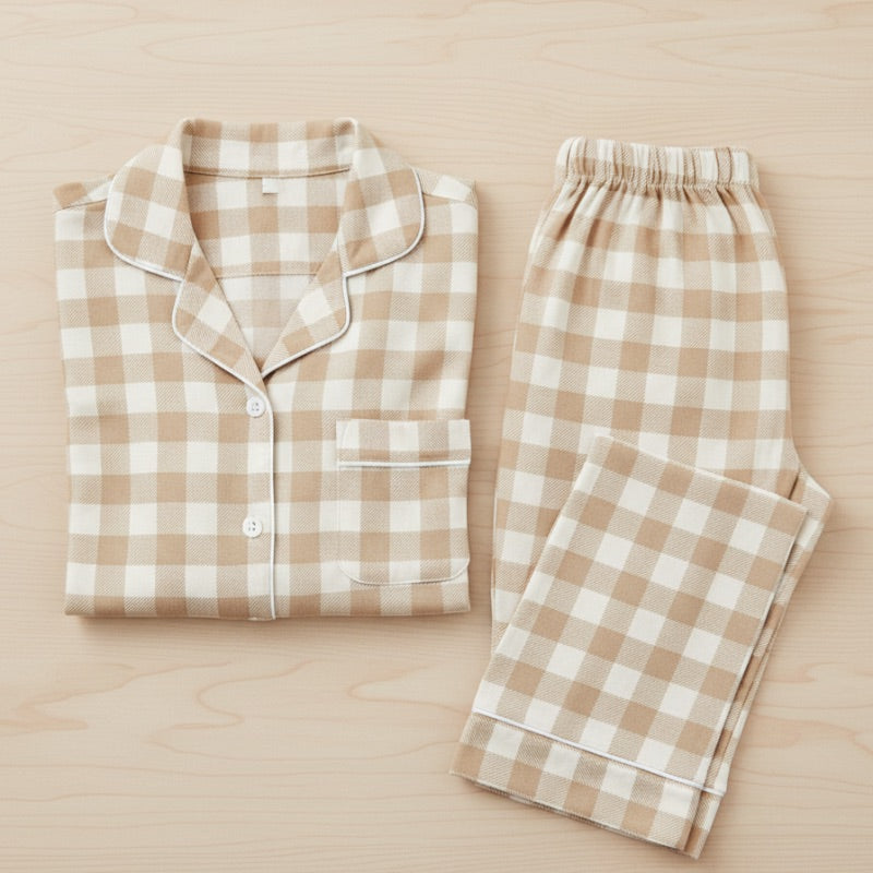 Beige and white checkered pajama set on a wooden surface