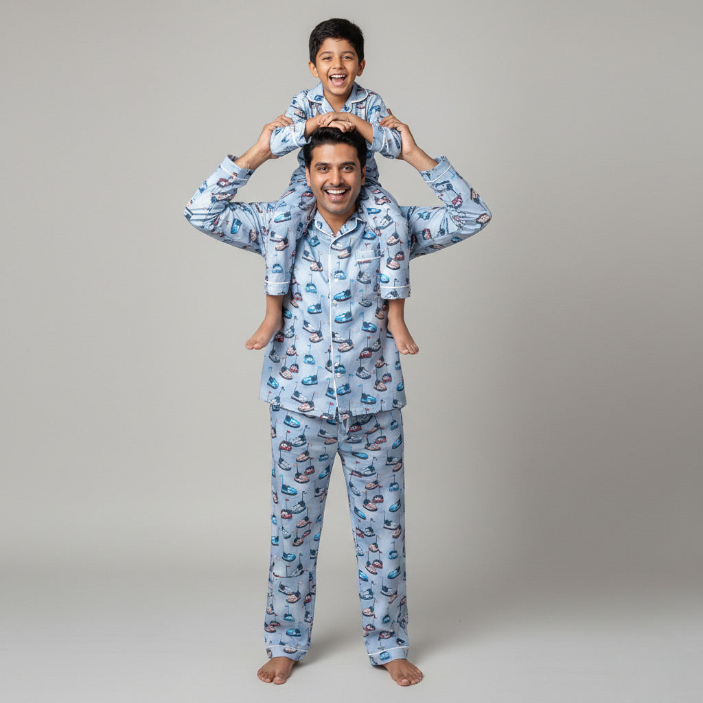 Father and son in bumper car print matching pajama set, fun coordinated look.