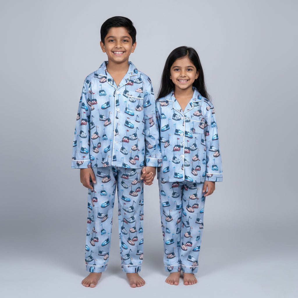 Siblings in bumper car matching pajamas, fun ride-themed coordinated nightwear.