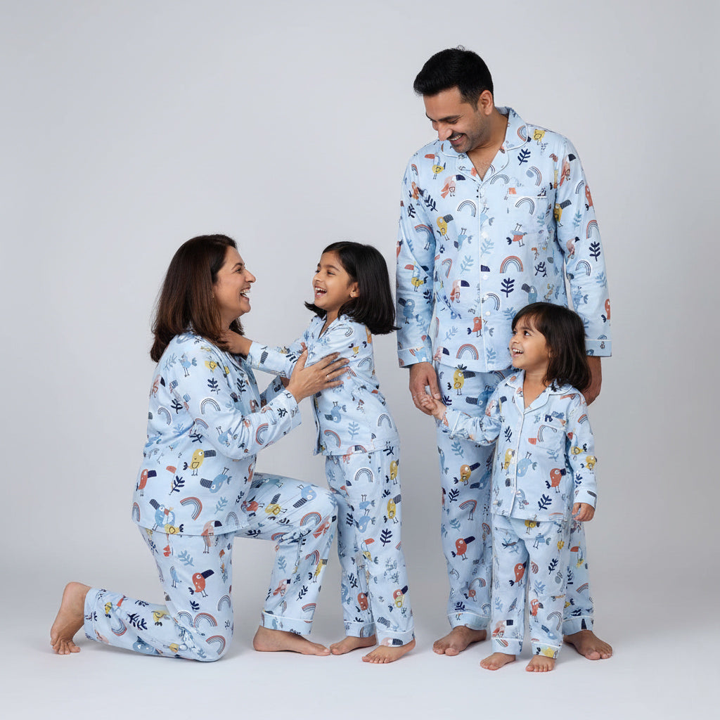 Family wearing chirpy sleep matching pajamas, cheerful green printed nightwear.