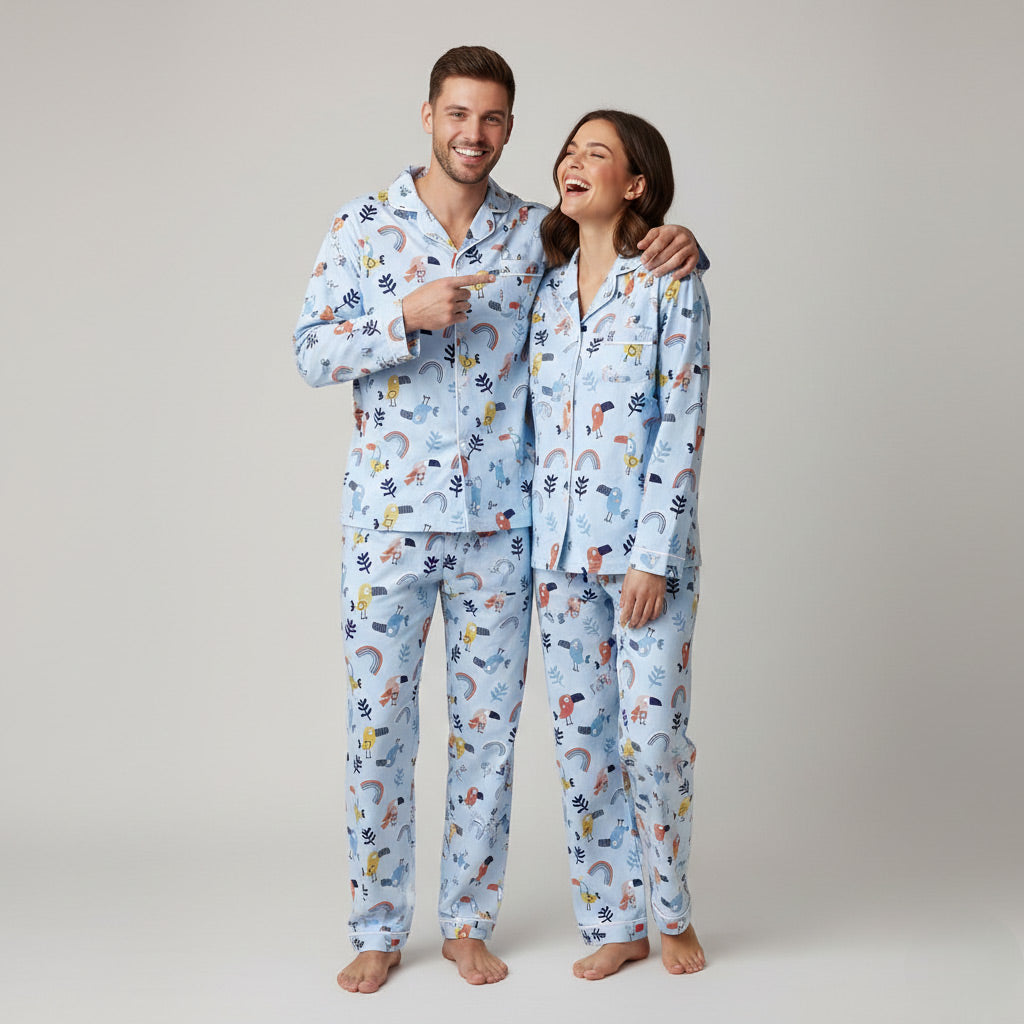 Couple in Chirpy Sleep matching pajama set, cheerful printed coordinated look.