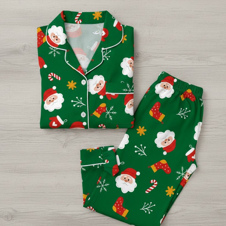 Christmas-themed pajama set with Santa Claus design on a wooden surface