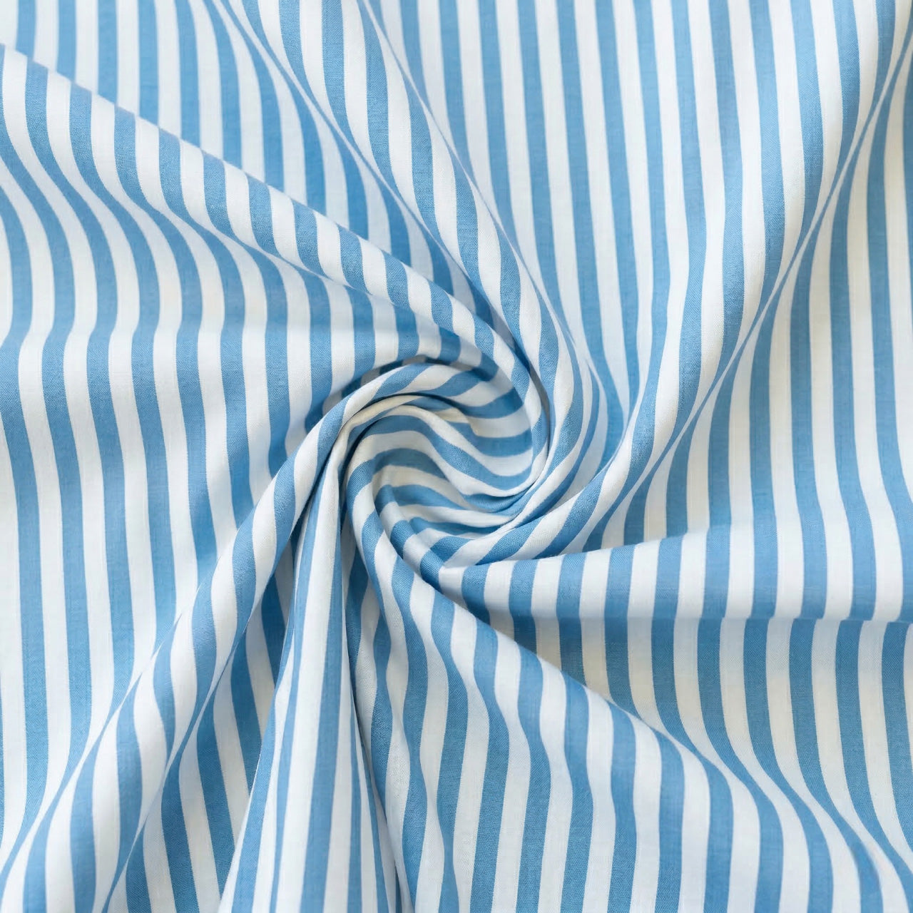 Aqua Blue and white striped fabric in a swirl pattern
