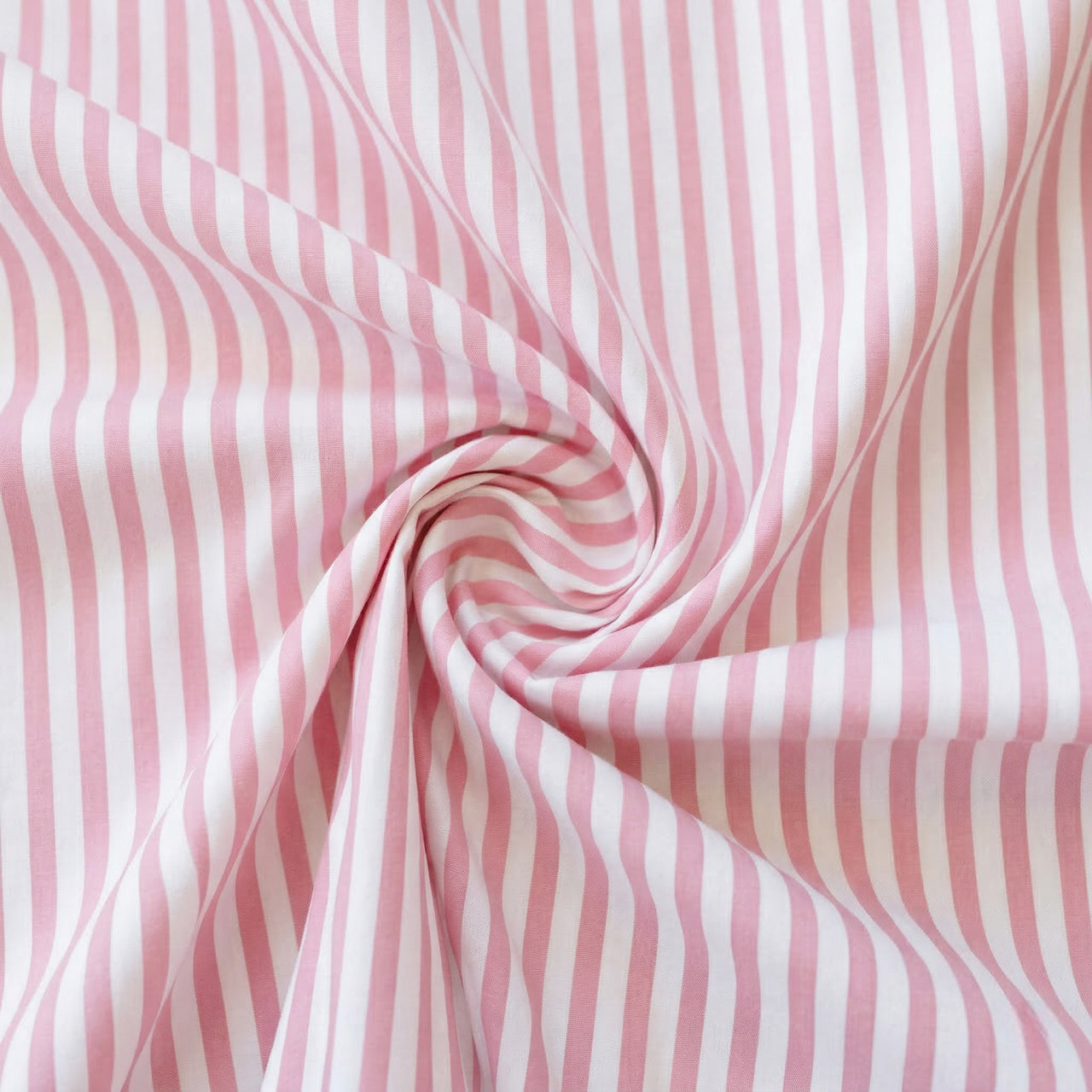 Pink and white striped fabric with a swirl pattern