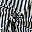 Black and white striped fabric in a swirl pattern