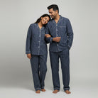 Couple cotton sleepwear in classic navy stripe with relaxed fit.