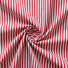 Red and white striped fabric in a swirl pattern