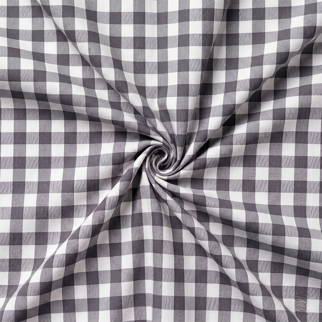 Close-up of gray and white checkered fabric with a swirl pattern.