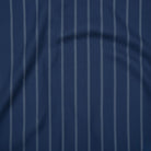 Deep navy cotton fabric with soft grey stripes