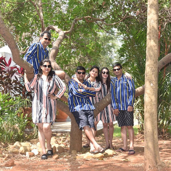 Friends wearing matching sleepwear on a vacation