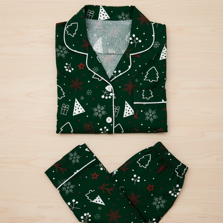 Green Christmas-themed pajama set on a wooden surface