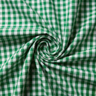 Green and white checkered fabric in a swirl pattern