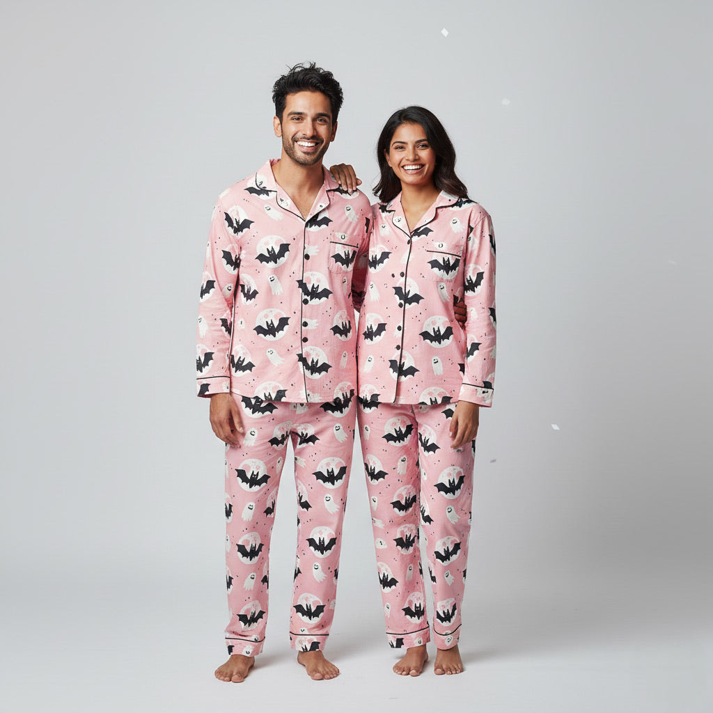 Couple in Halloween matching pajama set, spooky themed coordinated nightwear.