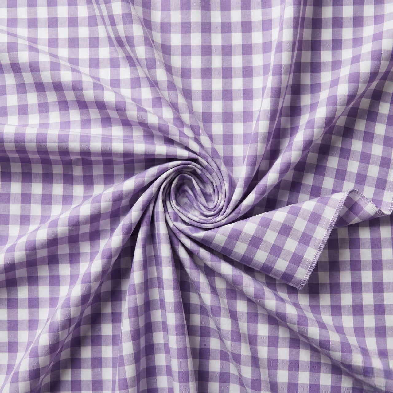 Purple and white checkered fabric in a swirl pattern