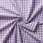 Purple and white checkered fabric in a swirl pattern