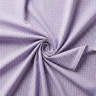 Close-up of purple and white checkered fabric with a swirl pattern.