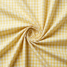 Yellow and white checkered fabric in a swirl pattern