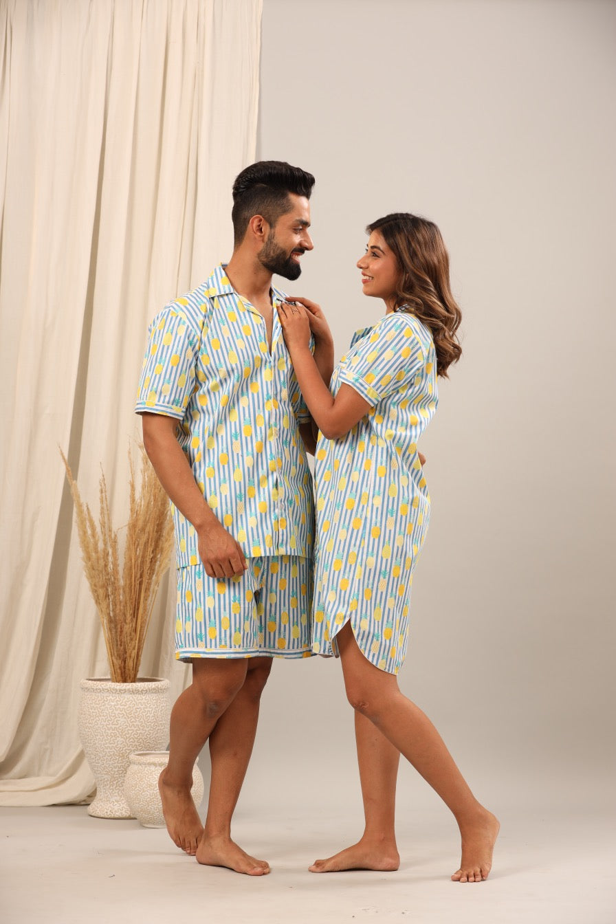 Mom and Dad wearing matching blue and yellow striped pajama sets against a neutral background.