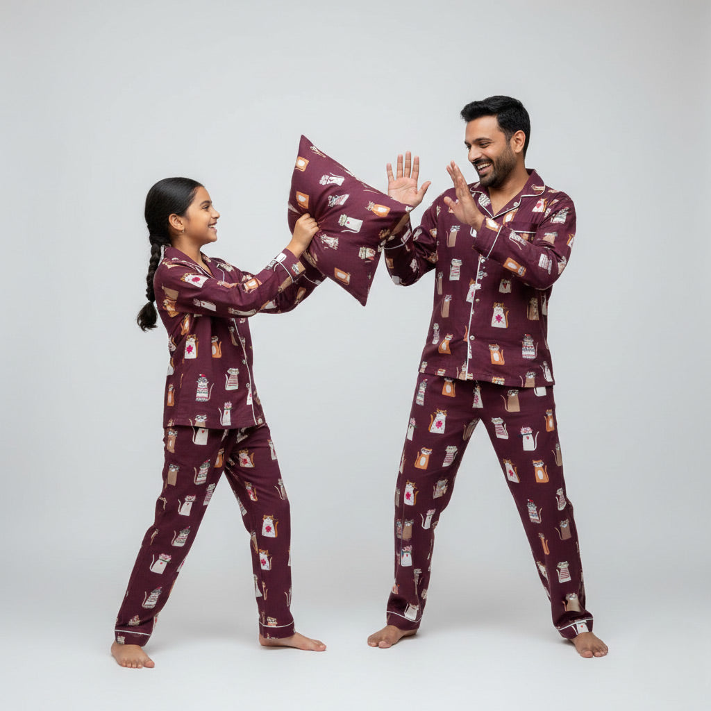 Father and daughter in Meow Meow cat print matching pajama set, cute coordinated nightwear.