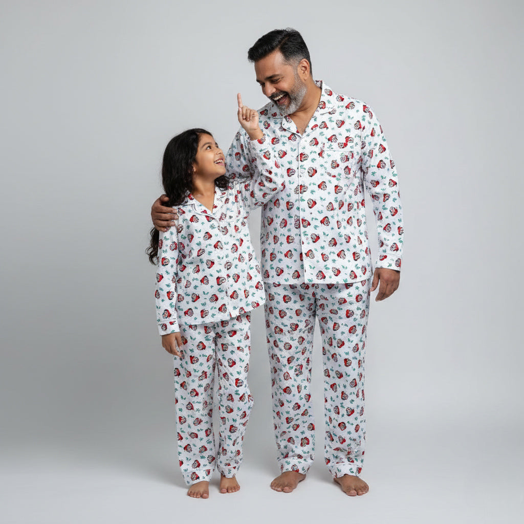 Father and daughter wearing Mickey Mouse print matching pajamas, character-themed coordinated nightwear.
