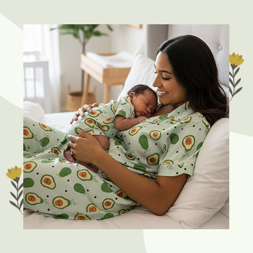 Woman and baby wearing matching green pajamas with avocado pattern in a bedroom setting