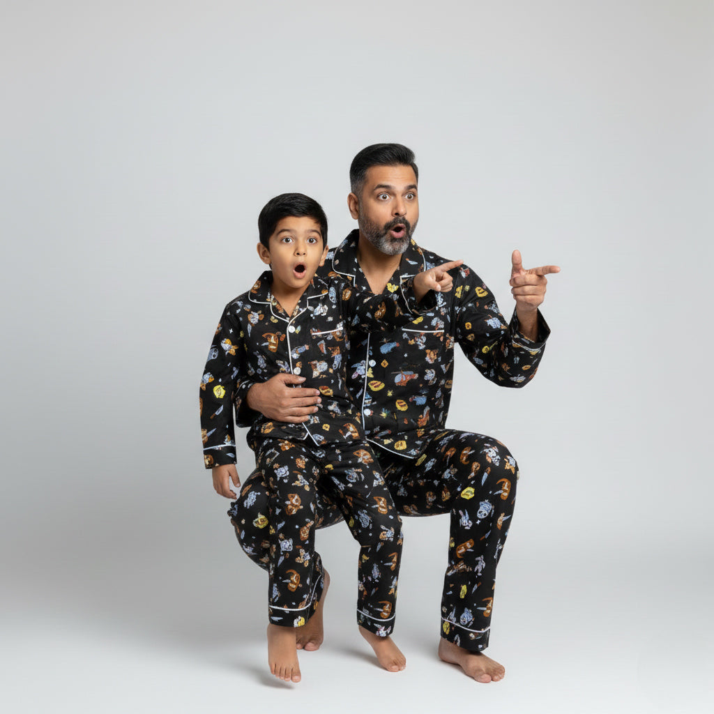 Father and son in owl flight print matching pajamas, soft coordinated nightwear.