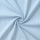Blue and white striped fabric with a swirl pattern