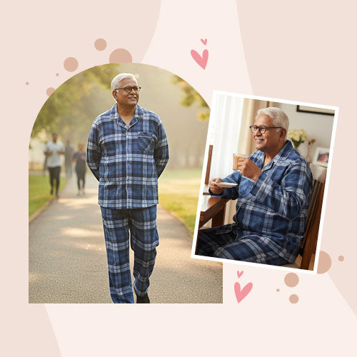 Man wearing blue plaid pajamas walking outdoors and sitting at a table.