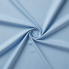 Powder blue cotton fabric for soothing couple pajamas and quiet evenings.