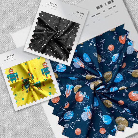 Fabric swatches with space themed icons for sleepwear