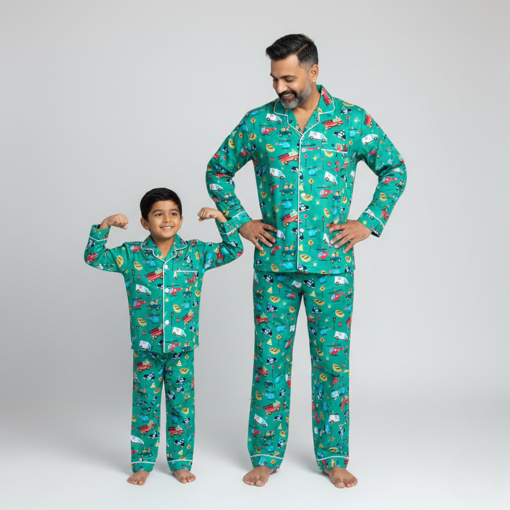 Father and son wearing speeding vehicles print matching pajamas, playful coordinated nightwear.