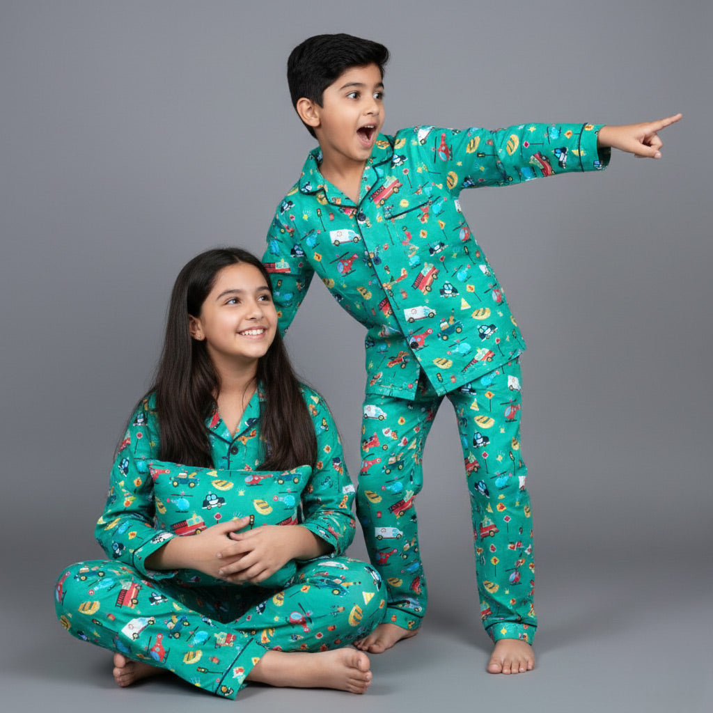 Brother and sister in speeding vehicles matching pajamas, fun car-themed coordinated set.