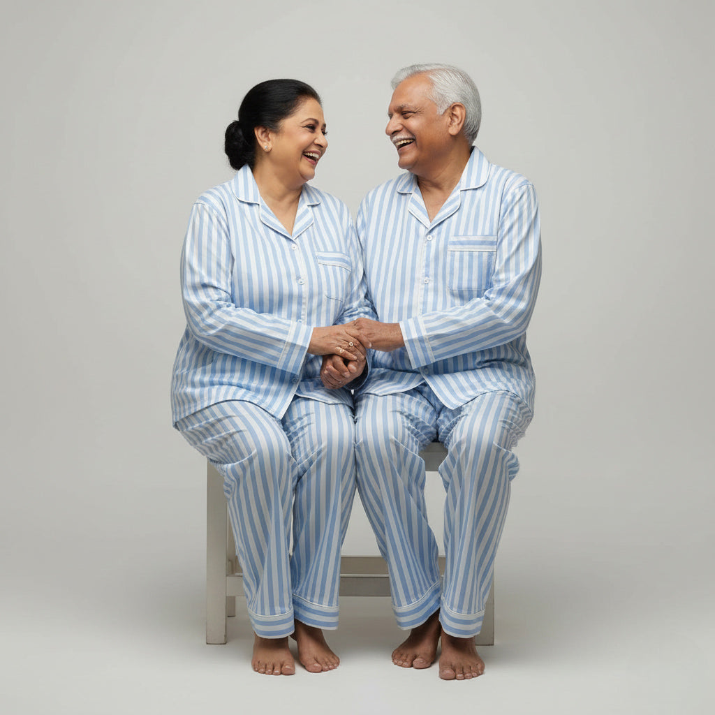 Elderly couple in Stripe Life matching pajama set, classic striped coordinated design.