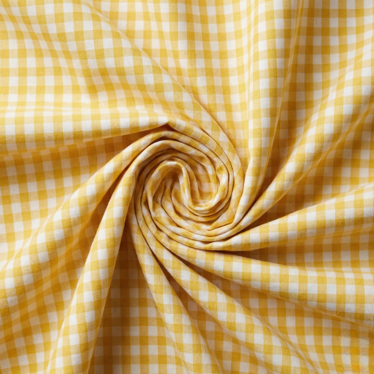 Yellow and white checkered fabric in a swirl pattern
