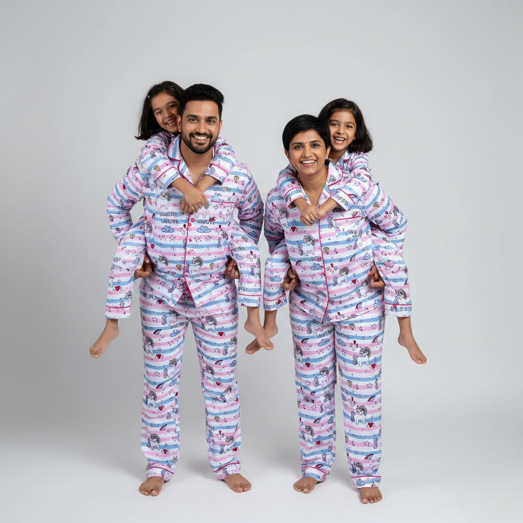 Family wearing unicorn stripe matching pajamas, coordinated in playful printed nightwear.