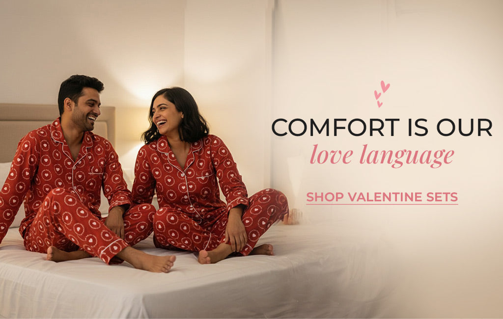 Couple relaxing in matching Valentine pajamas at home