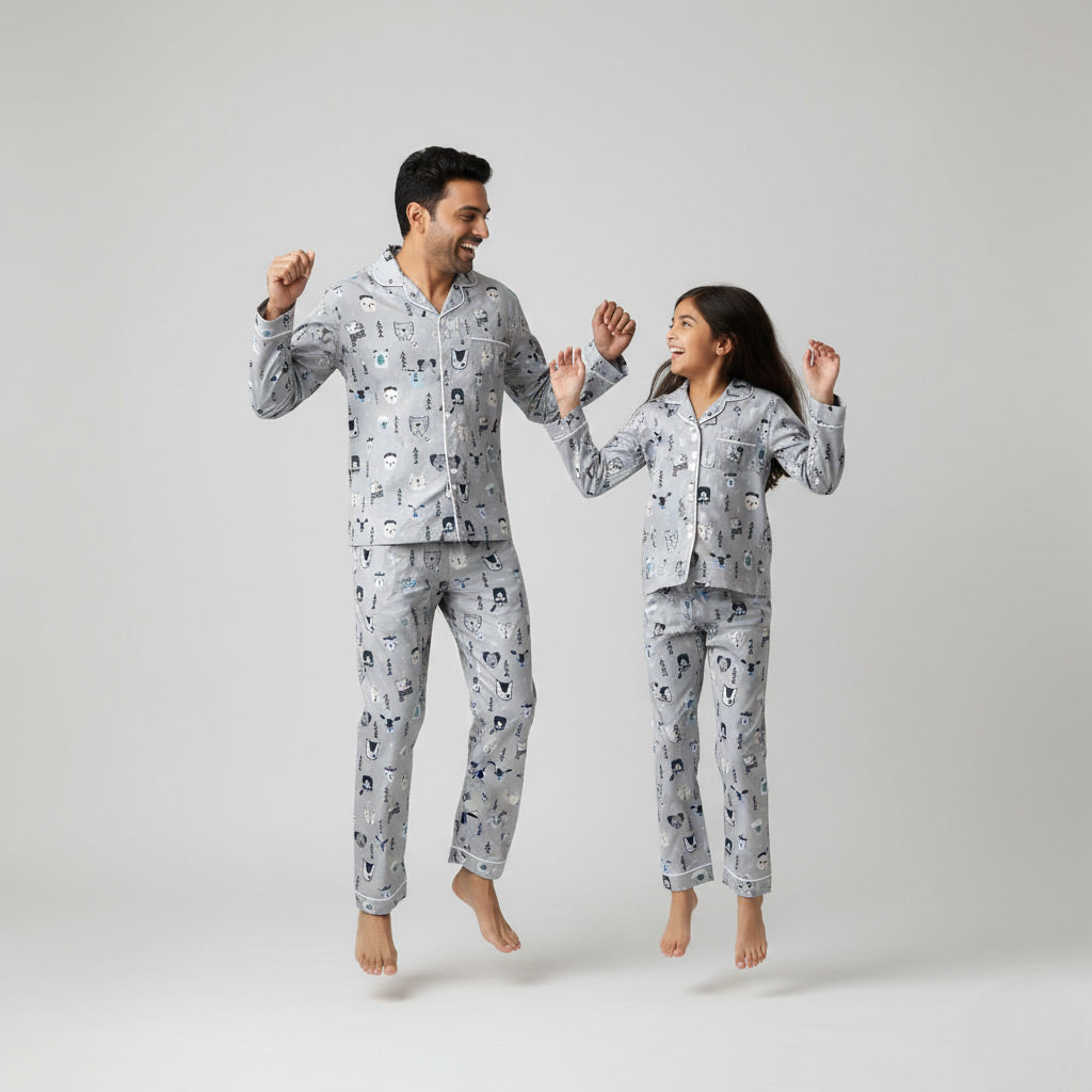 Father and daughter in white fox print matching pajama set, winter-themed coordinated nightwear.