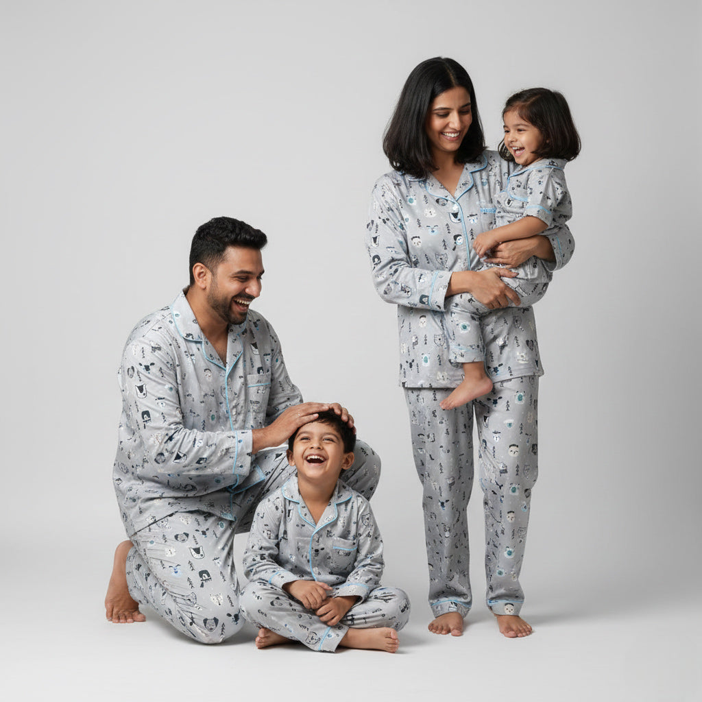 Family in white fox snow print matching pajamas, winter-themed coordinated outfits.