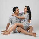 Husband and wife twinning in White Fox shorts set by Pajama Tribe