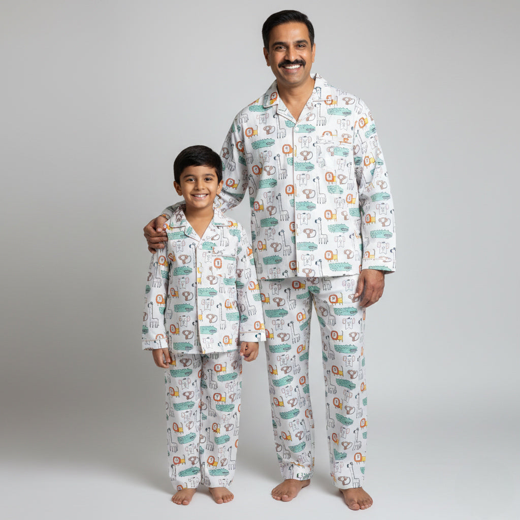 Father and son in wild animals matching pajama set, nature-themed coordinated print.