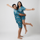 Husband and wife twinning in Zebra Herd shorts set by Pajama Tribe