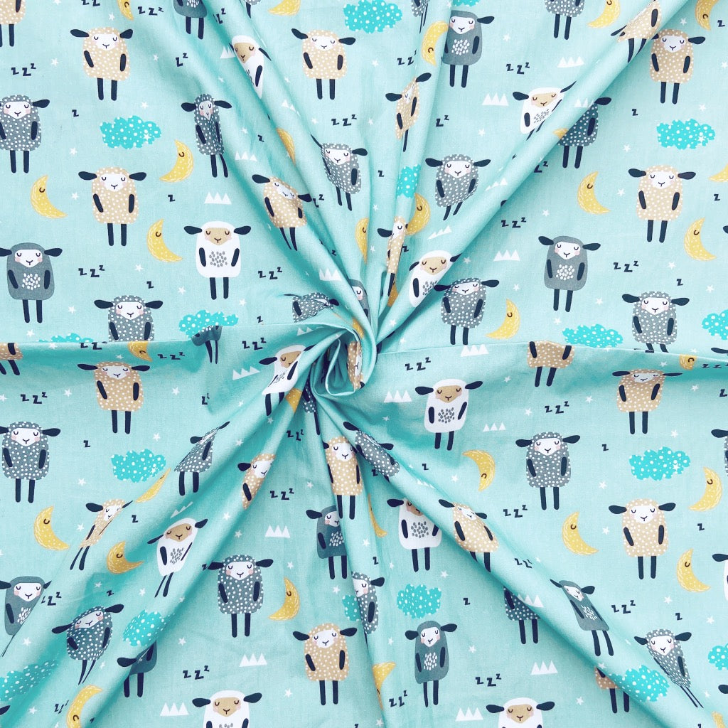 Sheepy Head cotton fabric for sleepy-time night suits, cosy kids’ pajamas and nap-time sets.