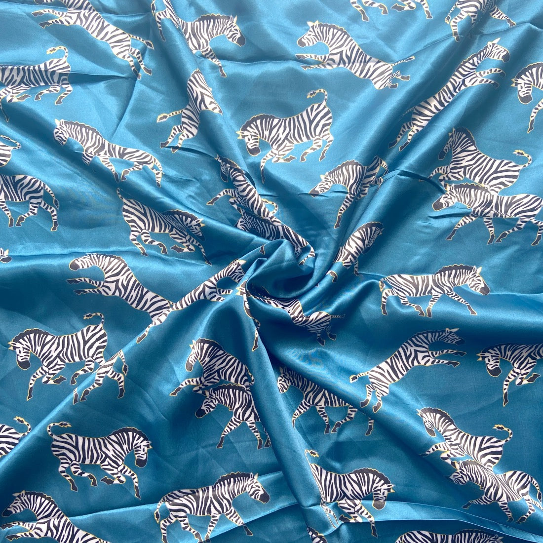 Zebra Herd Print in Satin fabric for playful themed night suits and bold matching sleepwear.